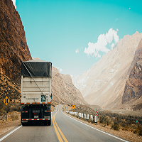 Semitruck driving between steep cliffs